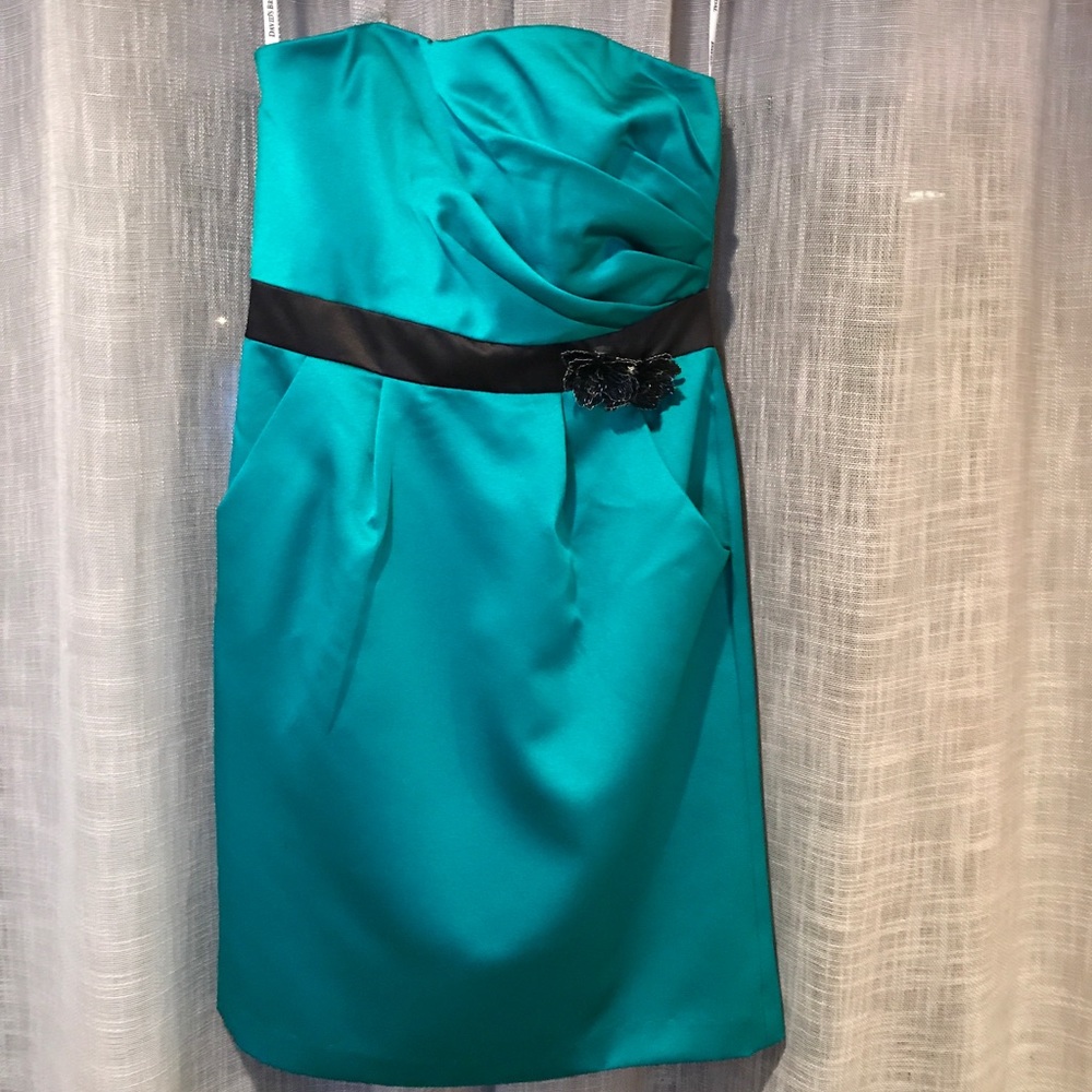 Green cocktail dress w/ black flower embellishment